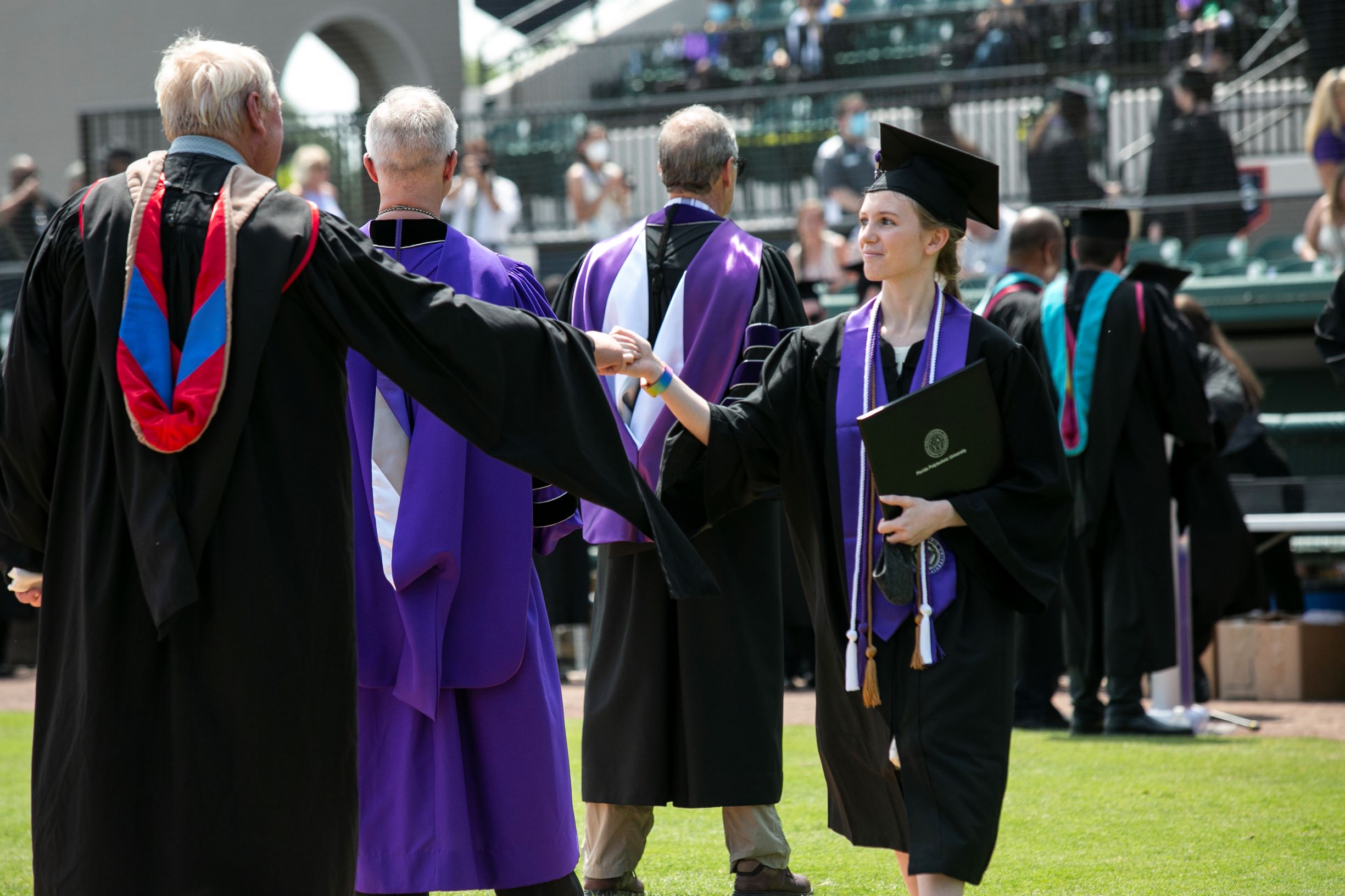 Florida Polytechnic University celebrated the graduation of its classes of 2020 and 2021 on Sunday, May 2, at Publix Field at Joker Marchant Stadium in Lakeland, Florida.