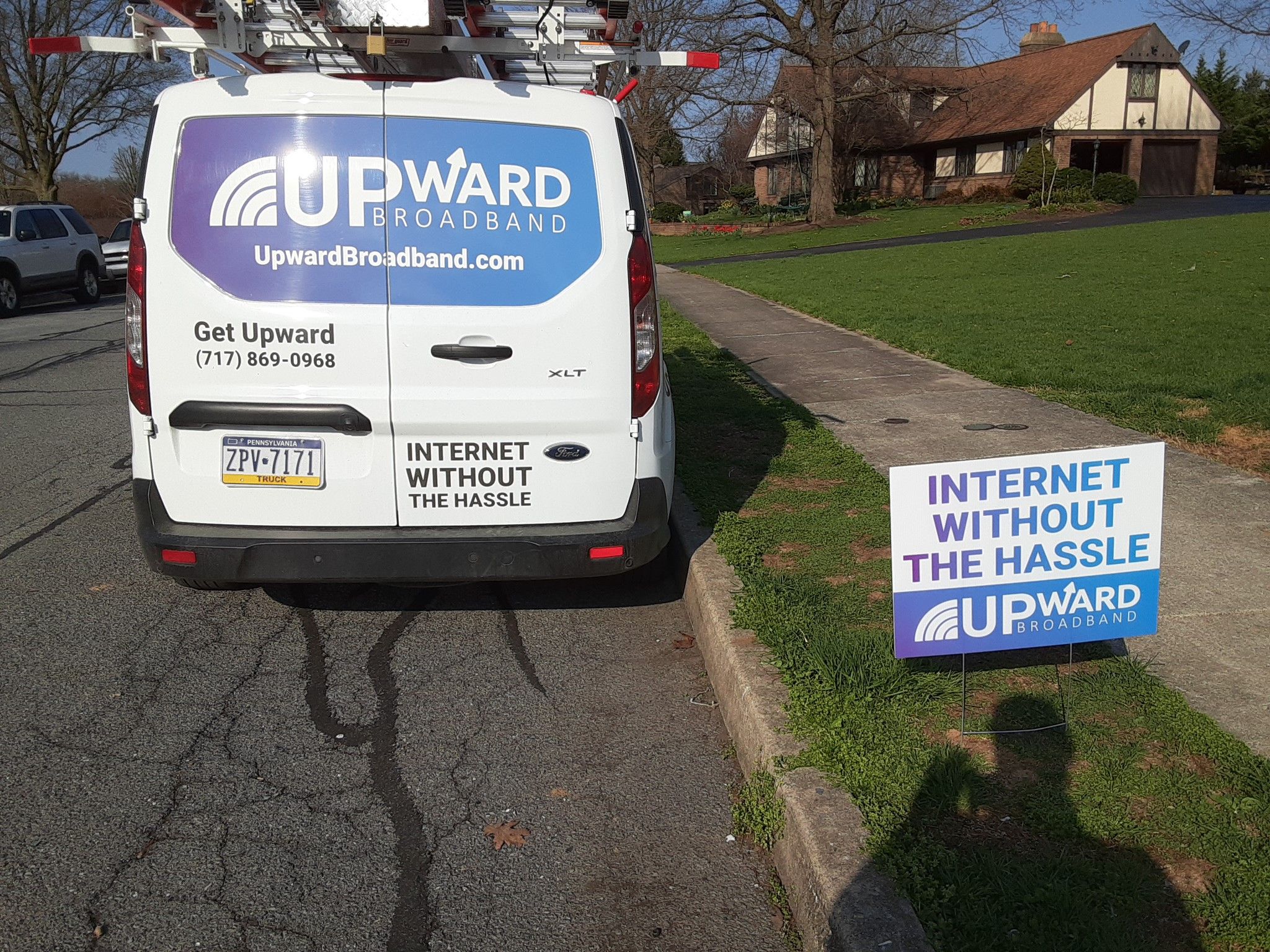 Upward Broadband service van and roadside sign