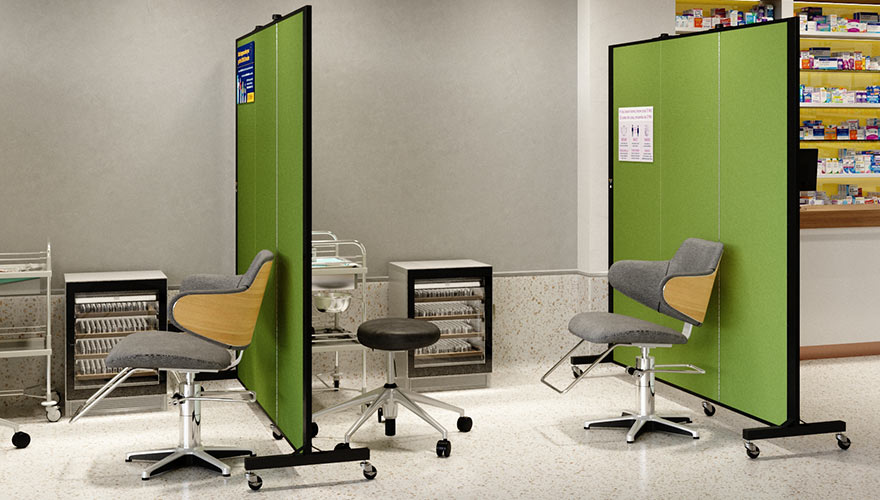 Temporary dividers offer privacy to patients as they get vaccinated.