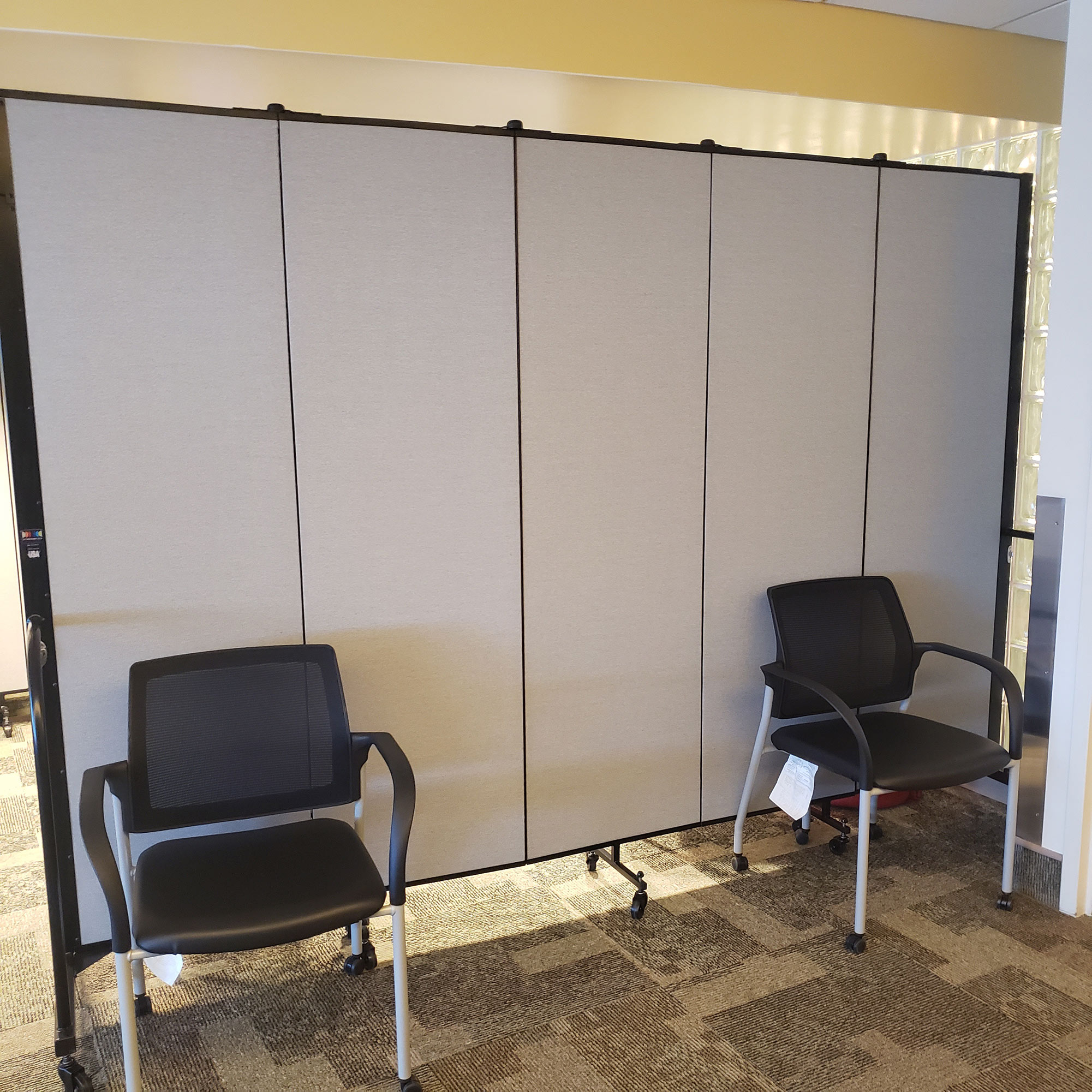 Portable walls creating a temporary waiting area for patients