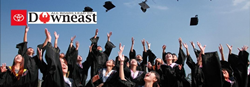 College Graduates Throwing Caps in the Air with Downeast Toyota Logo
