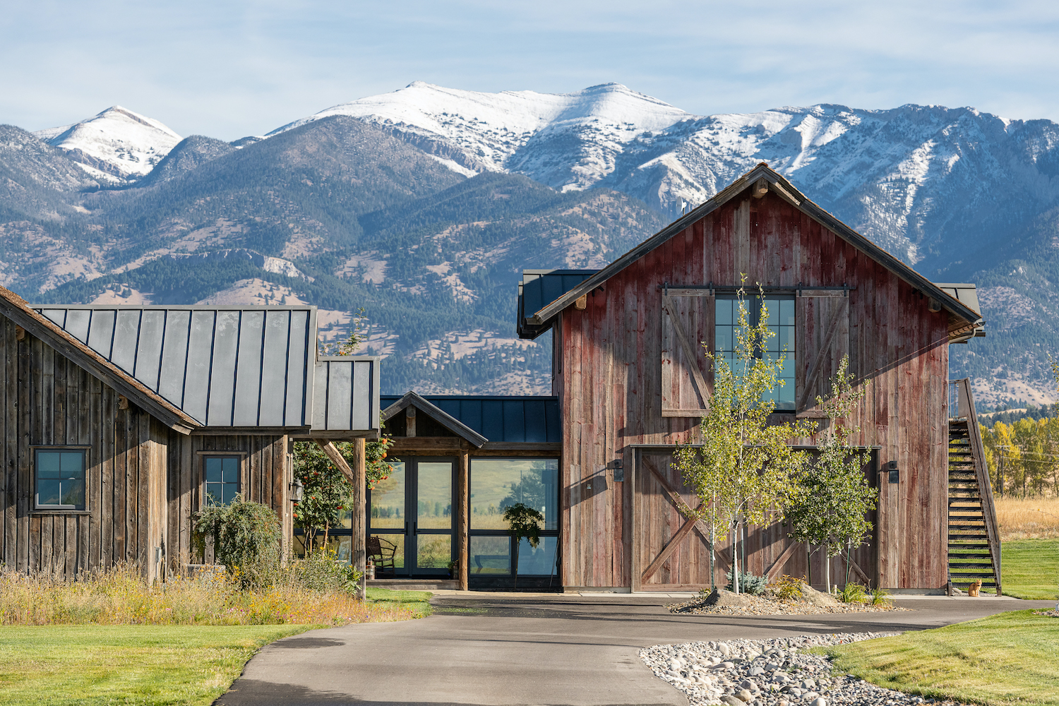 A familiar shape in the agricultural Gallatin Valley, a reclaimed-wood barn houses the garage and an apartment while celebrating JLF Architects’ embrace of Regionalism (photo: Audrey Hall).