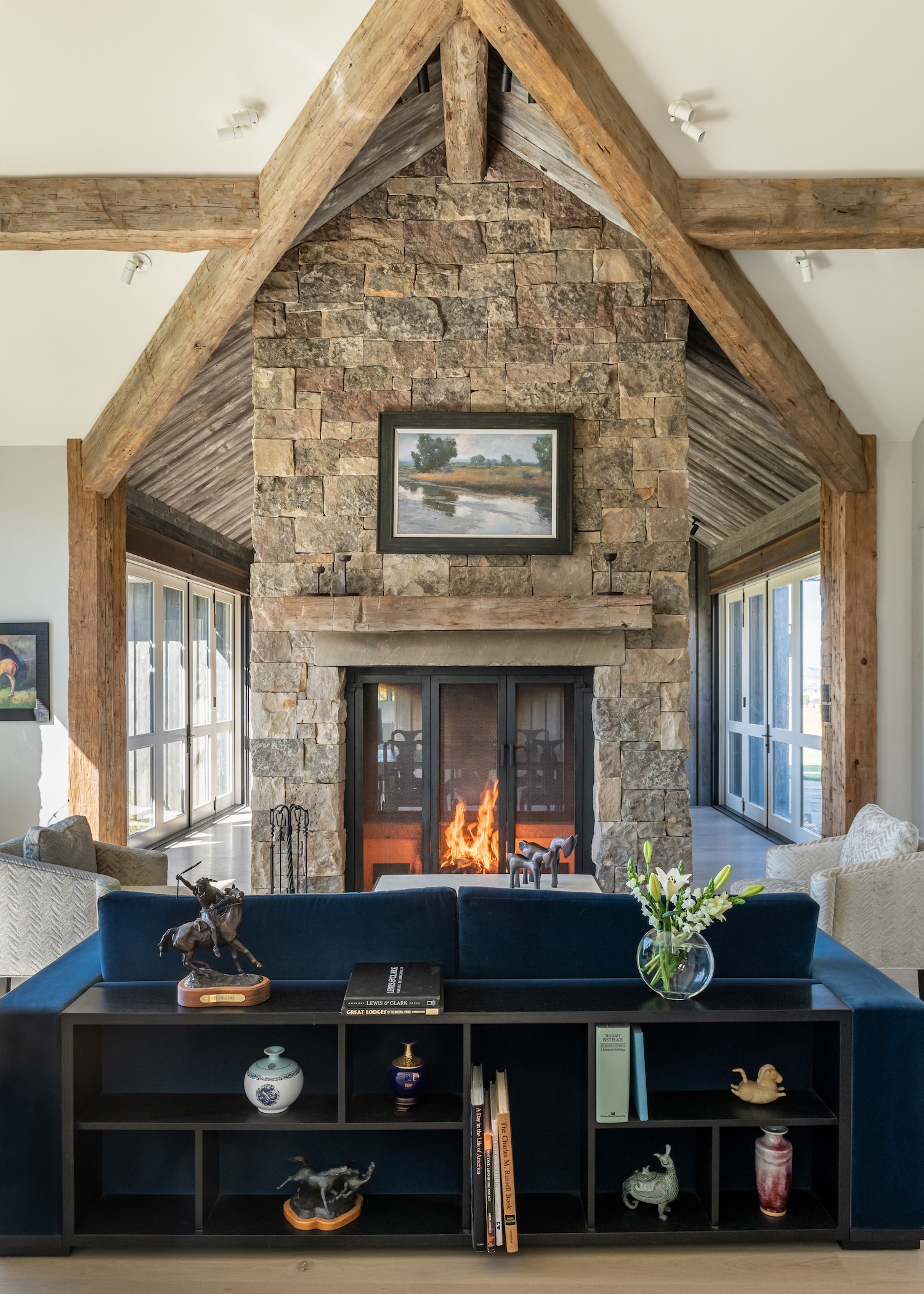 Objects collected during the homeowners’ time in China mingle comfortably with the work of Montana artists in the living room of the house by JLF Architects (photo: Audrey Hall).