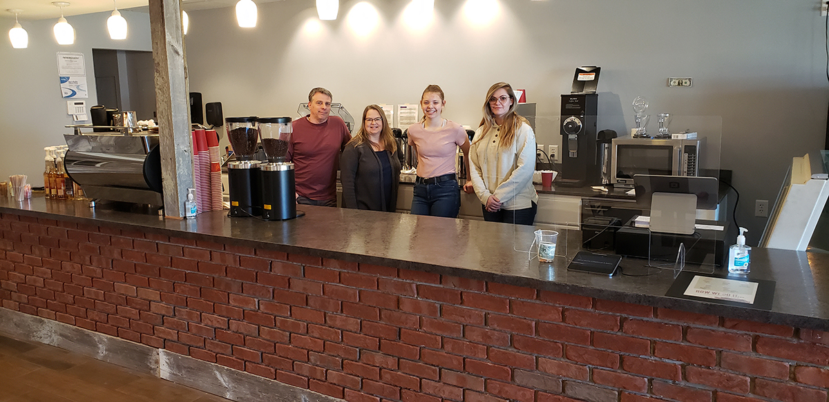 Owners Kim and Mark Sementa and their team inside Sweet Aroma Coffeehouse & Bakery