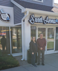 Owners Kim and Mark Sementa in front of Sweet Aroma Coffeehouse & Bakery in Colchester, Connecticut