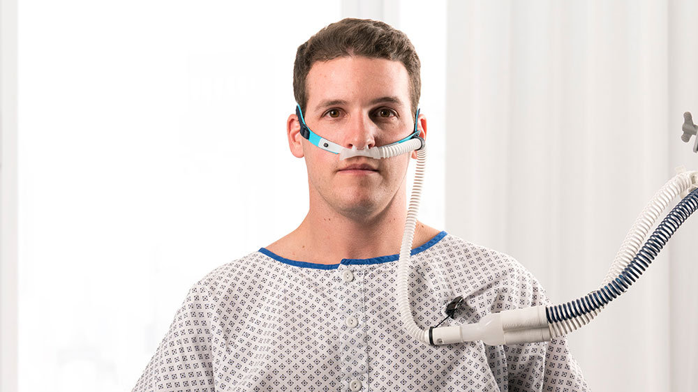 Patient receiving therapy via a high flow nasal cannula (HFNC)