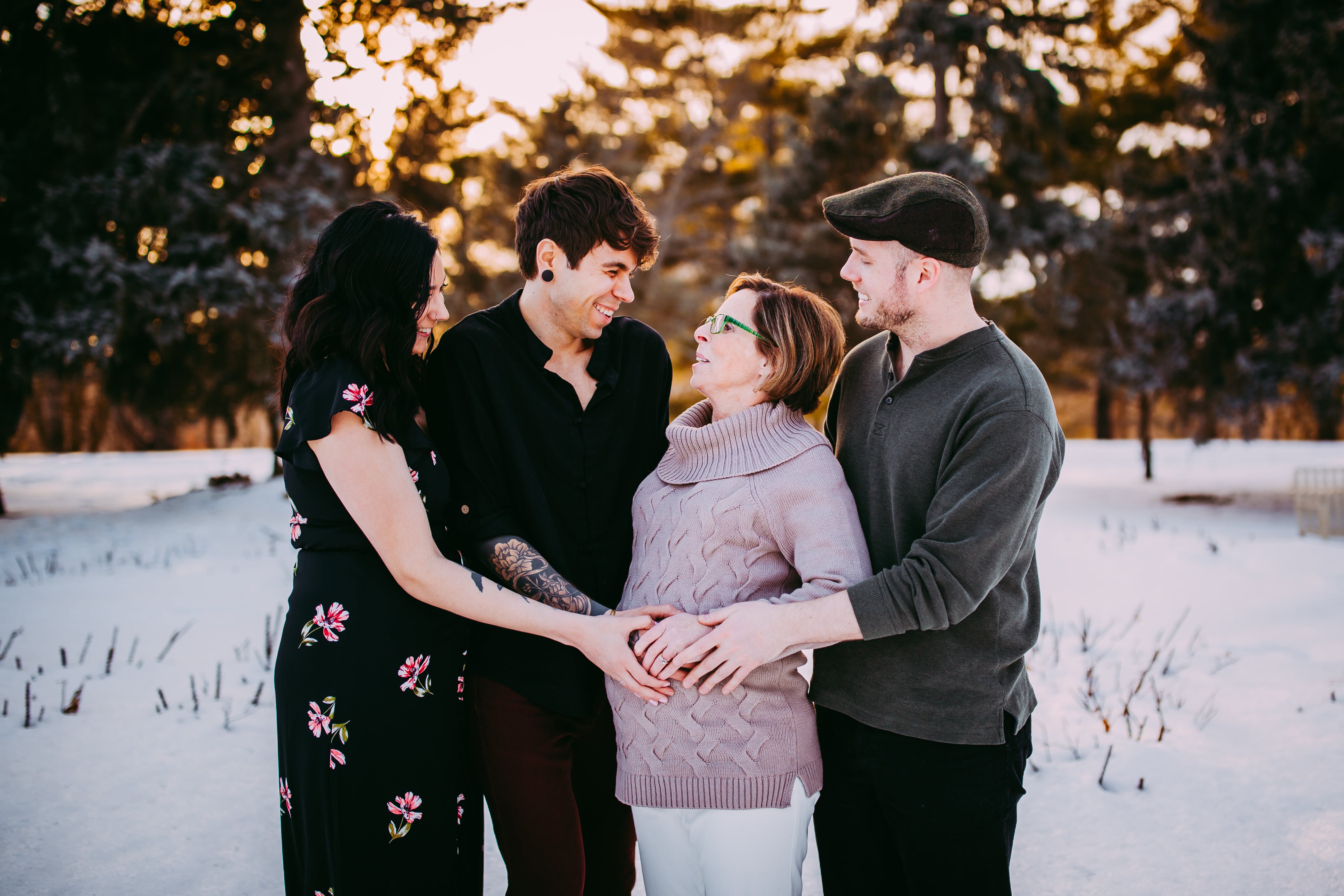 A photo from the maternity shoot for Elliot and Matt with Elliot's sister, who acted as their egg donor, and Matt's mother, who was their gestational surrogate.