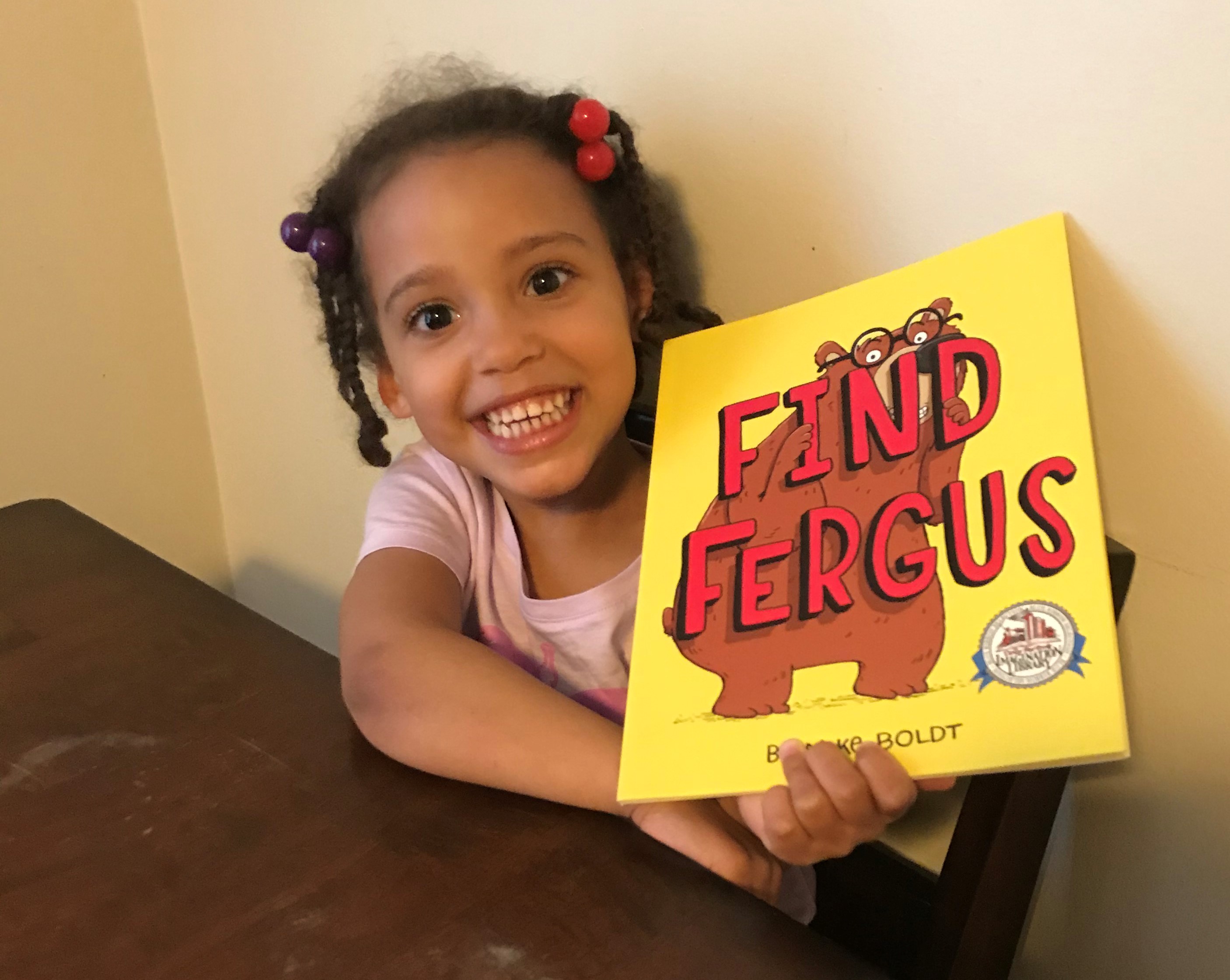 A Frederick County child with a book from the Dolly Parton’s Imagination Library program.