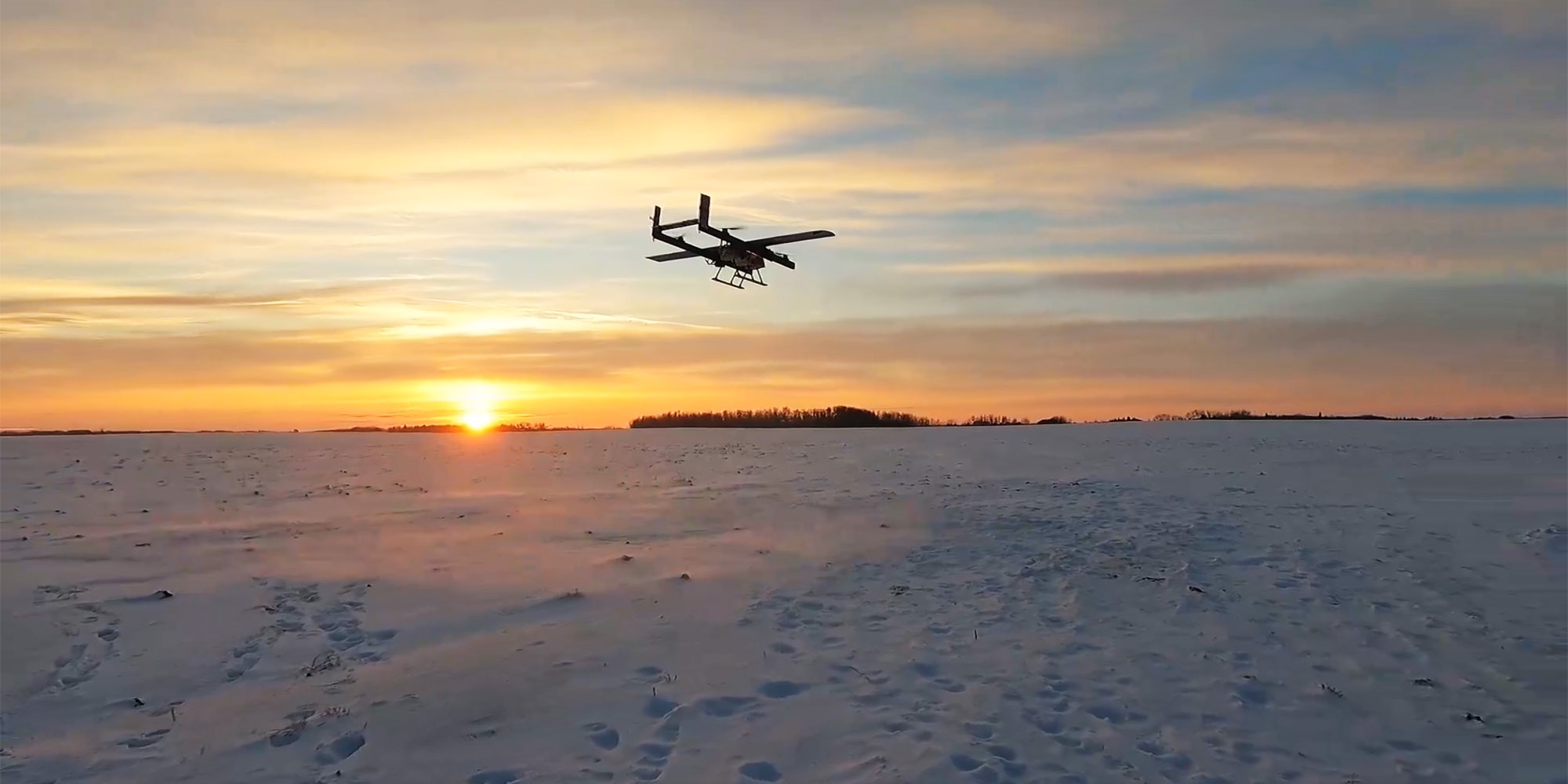 A Pegasus Imagery PV-02 EOS lifts off for a winter flight. The PV-02 Eos is a fixed-wing class III VTOL RPAS.