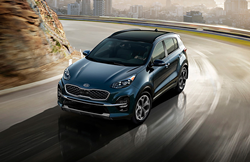 2022 Kia Sportage going around a curve.