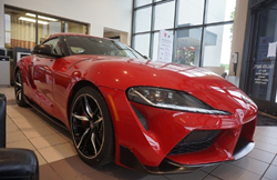 The front and side view of a red 2021 Toyota Supra at Roberts Toyota.