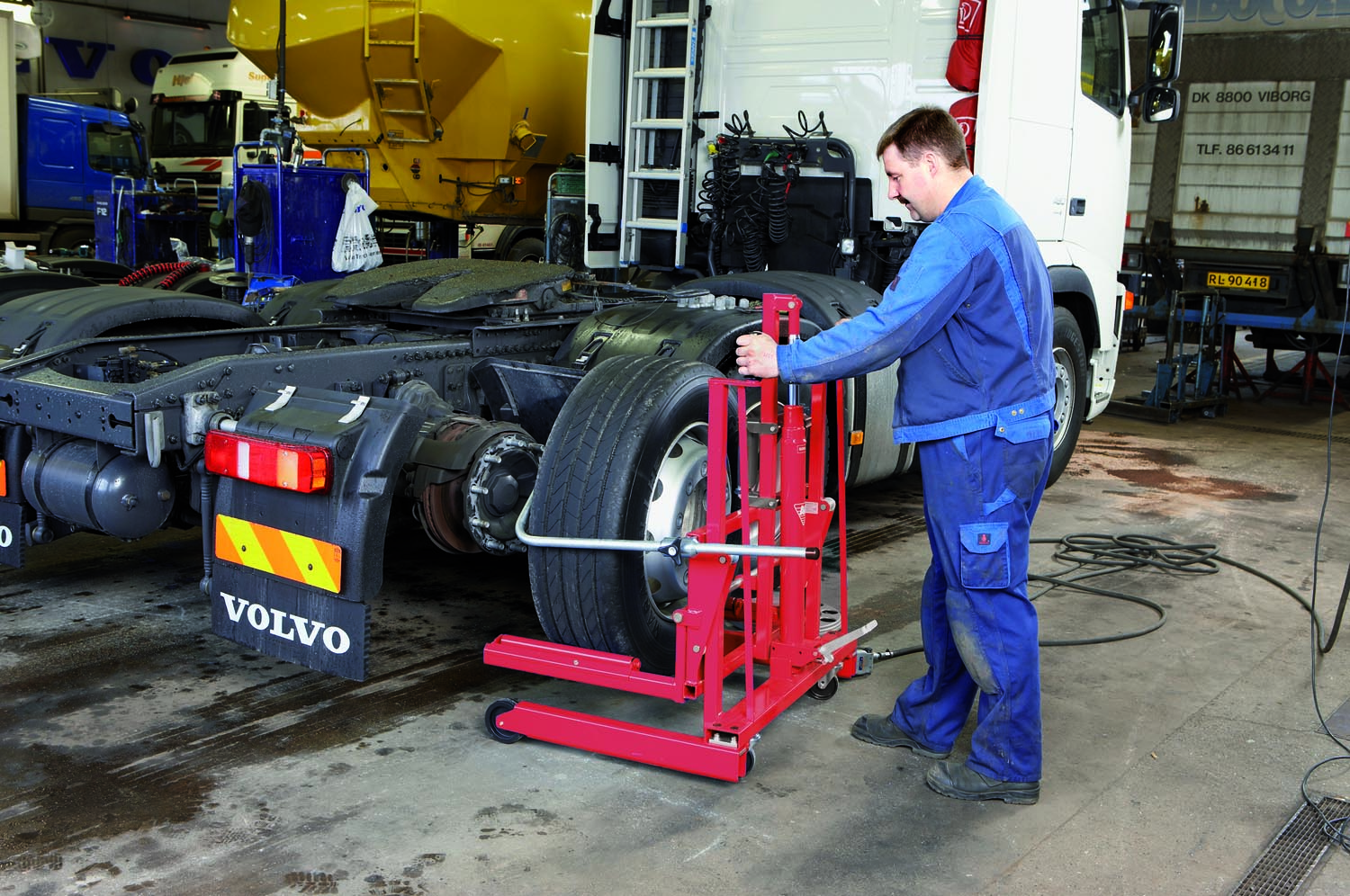 A high lift wheel dolly can improve safety, reduce back strain, and enhance productivity in the maintenance facility.