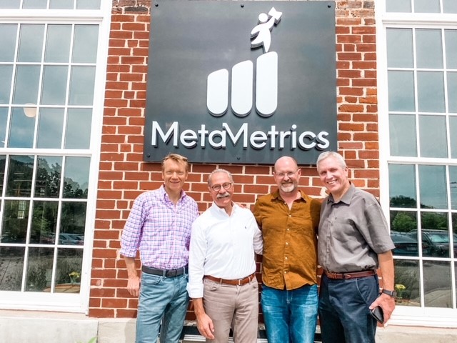 The MetaMetrics leadership team  –   Alistair Van Moere, Tim Klasson, Todd Sandvik and Malbert Smith – takes time out during its move to Golden Belt for a photo outside of its new Durham headquarters.