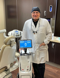 Newly trained LANAP clinician Sam Namdarian DMD poses with his PerioLase MVP-7 dental laser at Fresno Smiles Makeovers in Fresno CA