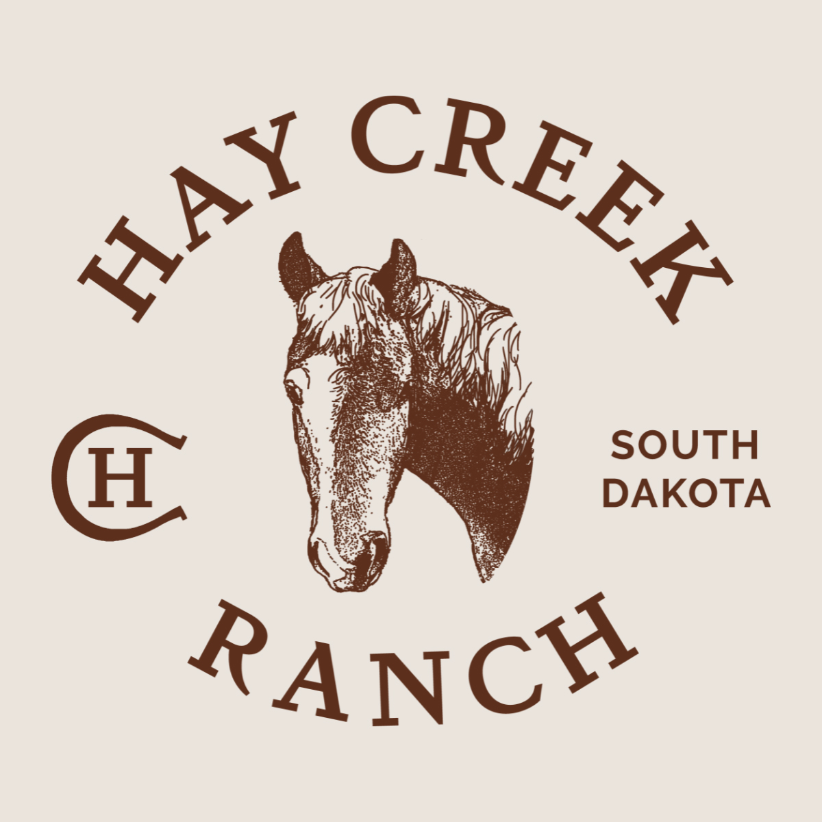 The new Hay Creek Ranch logo features Cindy's horse Charlie and a horseshoe shape.