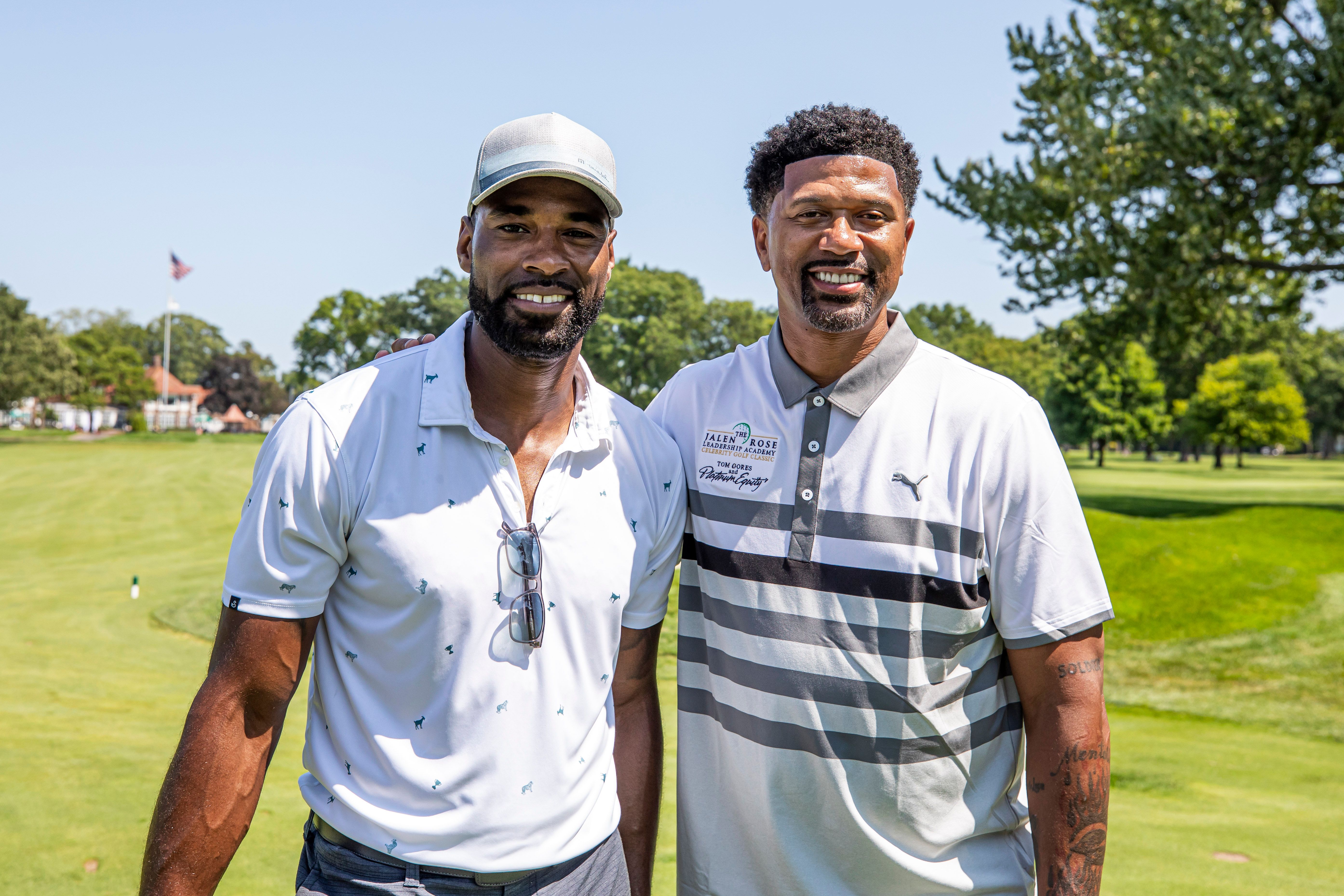 Calvin "Megatron" Johnson and Jalen Rose pose for a picture on the first fairway at Detroit Golf Club at the Jalen Rose Golf Classic, A PGD Global Production