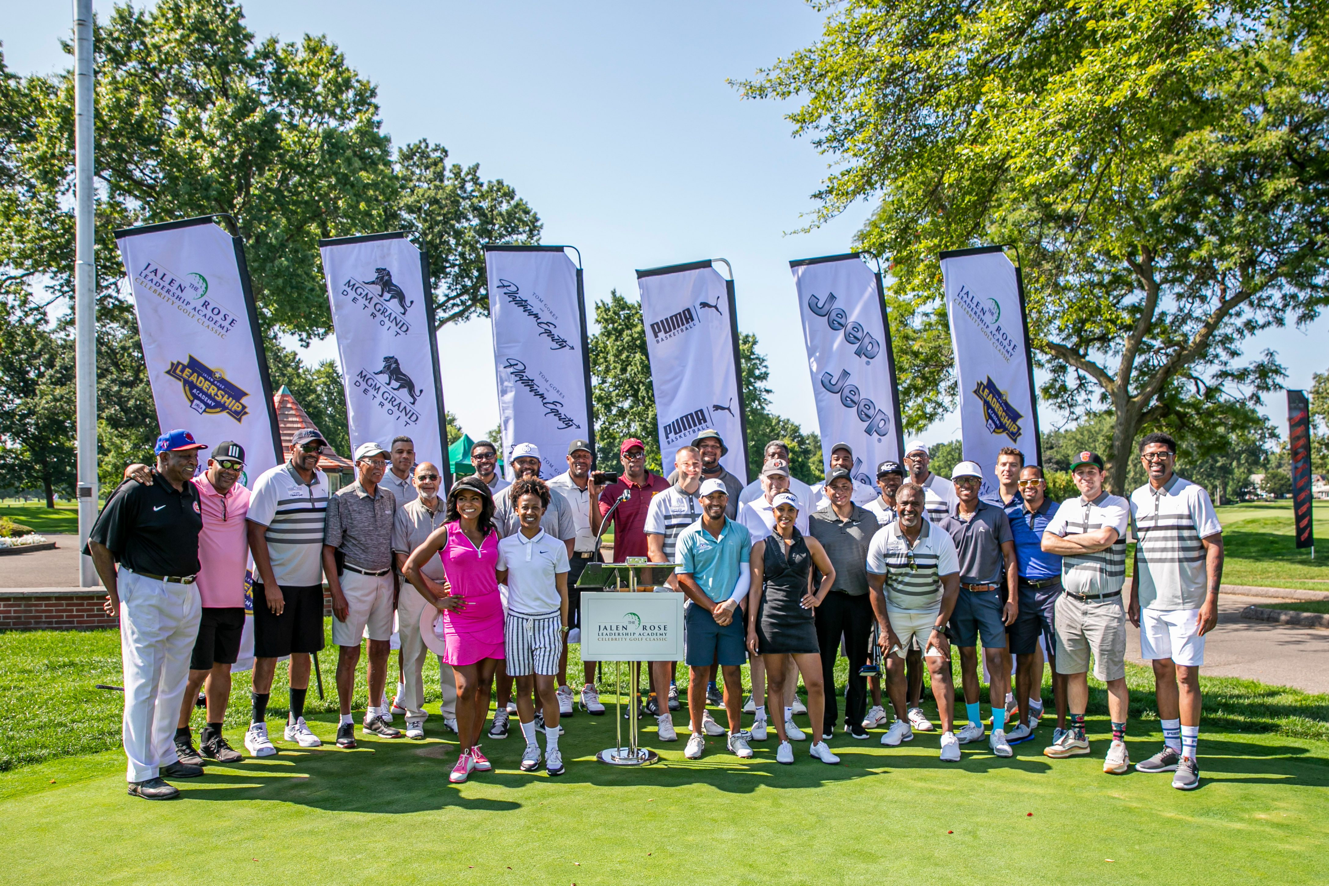 Participating celebrities at the 11th annual Jalen Rose Golf Classic, A PGD Global Production, pose for a photo at the opening ceremonies on the putting green at Detroit Golf Club.