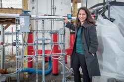 Stephanie Lansing at the Port of Baltimore with her anaerobic digestion system, designed to produce energy while cleaning water from the Chesapeake Bay
