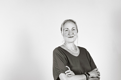 Dr. Candace Rutt posing for a headshot against a white background