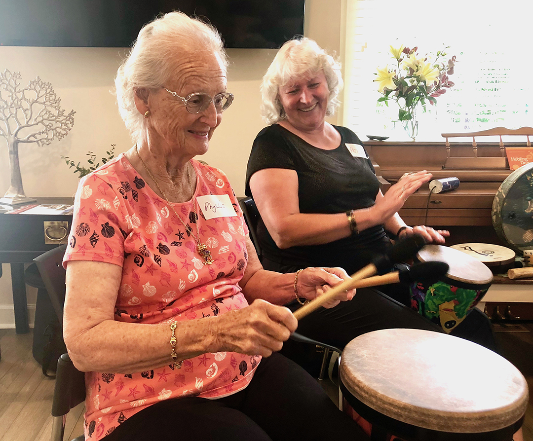 Peggy Jones and her mother, Phyllis in a drum circle at Leezas Care Connection