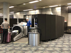Black dividers surround TSA screening at airport