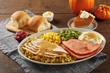 The Holiday Celebration Platter for dine-in or carryout on Thanksgiving includes slow-roasted turkey, three farm-fresh sides, bread and a slice of pie. A premium version features both turkey and ham.
