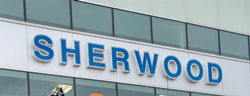 The Sherwood Ford sign on its building