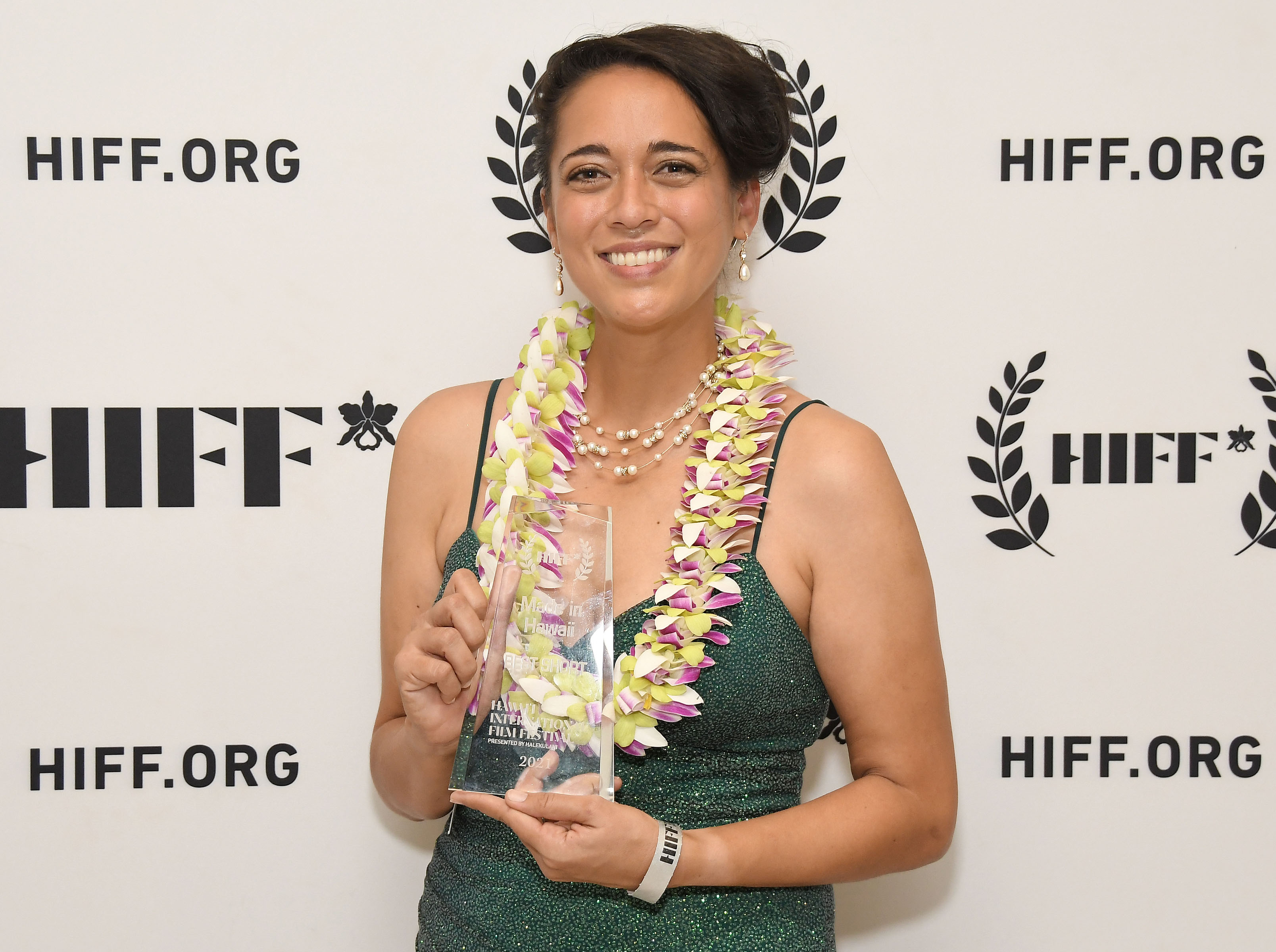 Actress Danielle Zalopany accepts the Best Made in Hawai’i Award Short  for RIVER OF SMALL GODS (Directed by Bradley Tangonan). Photo by Sthanlee B. Mirador/HIFF