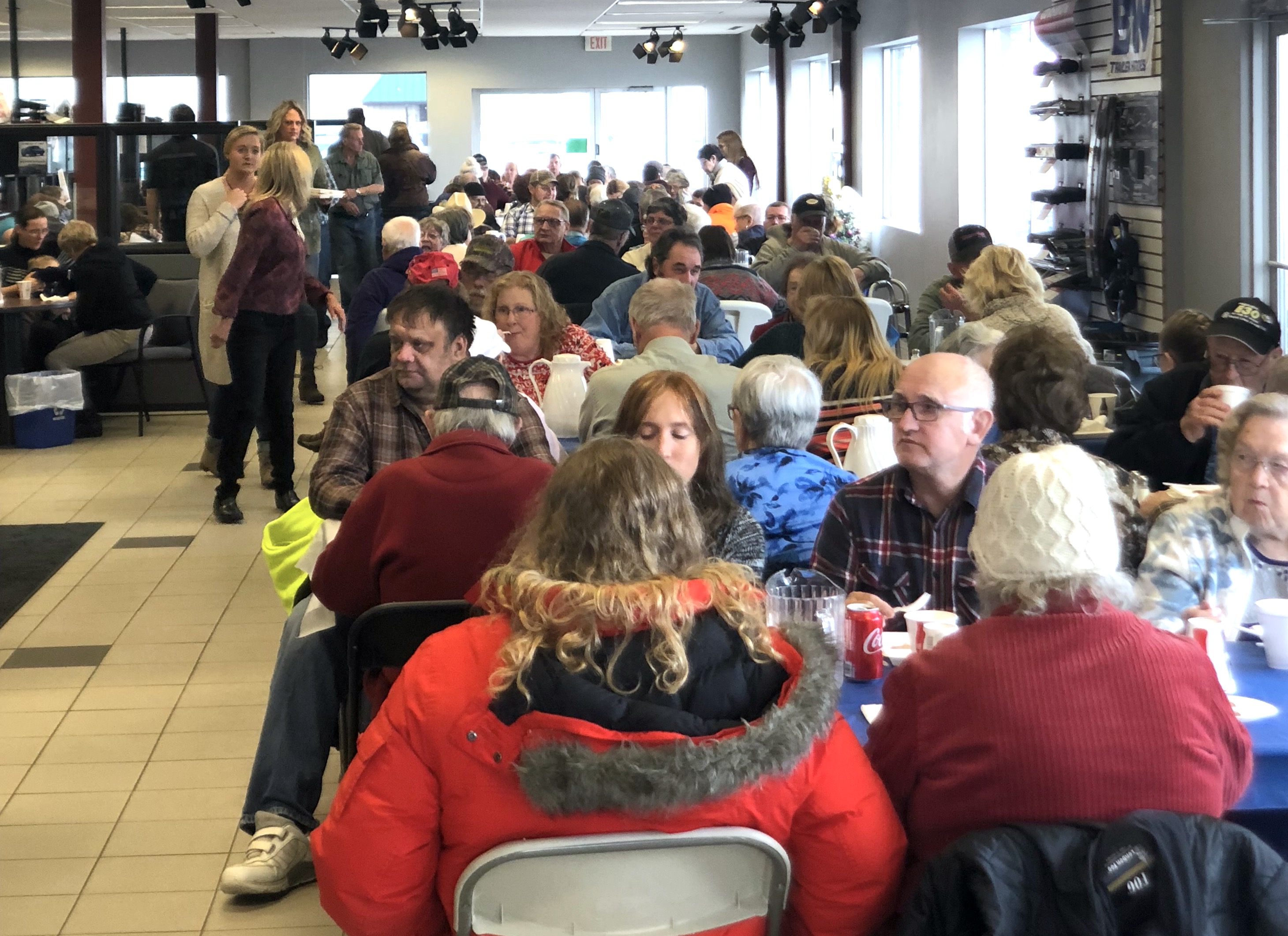 Guests enjoy a delicious home cooked meal at Watertown Ford Chrysler’s Annual Community Thanksgiving Dinner