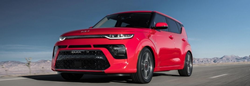 2022 Kia Soul Red driving on the road