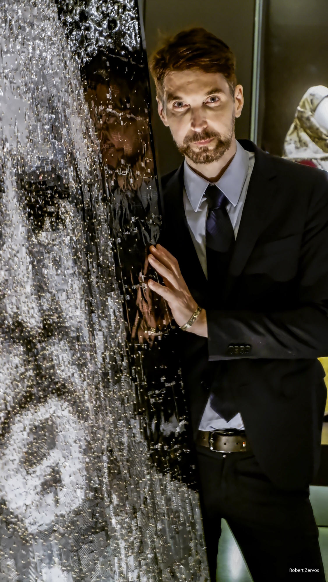 Nikos Floros next to mosaic portrait of Theodoros Kolokotronis