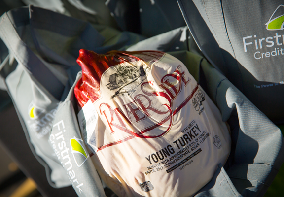 In appreciation for their resilience and commitment to teaching, Firstmark Credit Union donated 1,000 turkeys to 1,000 teachers in its annual giveback event.