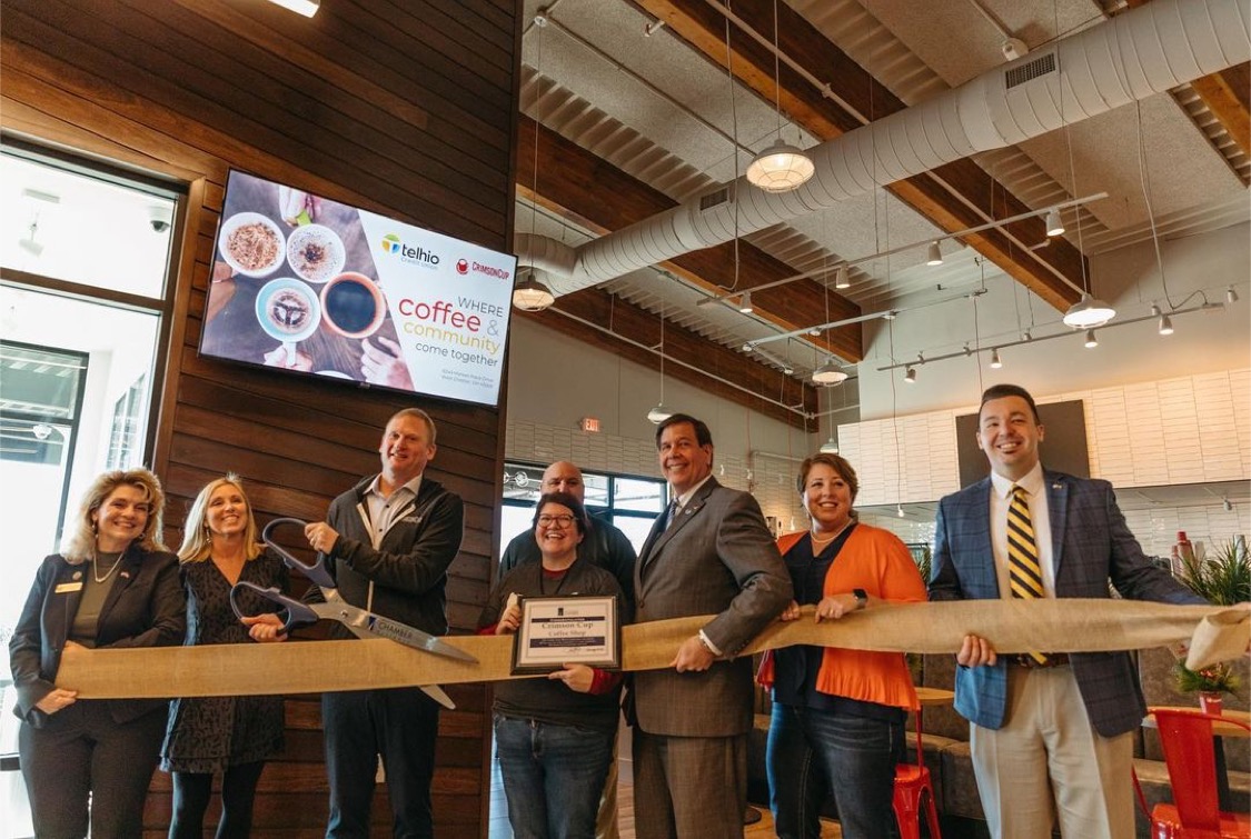 Greg Ubert, Founder and President of Crimson Cup Coffee & Tea, cuts the ribbon to open Crimson Cup Coffee Shop West Chester
