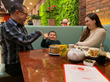 Founder of Uncle Lou and staff playing with kids as they enjoy their Cantonese Chinese food. Everyone is enjoying their Chinese food in a family environment.