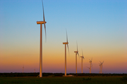 Wind turbine in sunset - Solas Energy Consulting