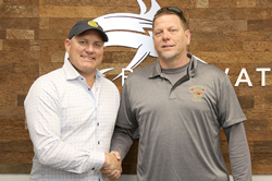 Blue Water's CEO Todd Burbage poses with Barry Outten, Fire Chief at Greenbackville Volunteer Fire Department, after donating land with a value of $1.1 million to the department.