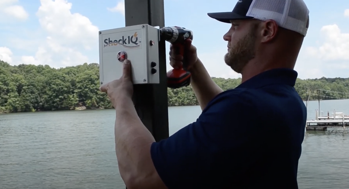 Tyler Thompson installing a ShockIQ Mobile system on Lake Lanier. The system will prevent Electric Shock Drowning from happening by monitoring your dock and water for electricity.