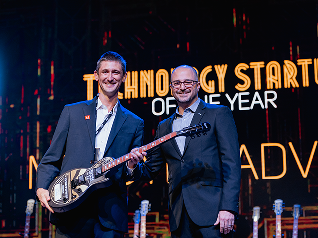 Mployer Advisor Founder and CEO Brian Freeman (left) is presented with the award for "Technology Start-Up Company of the Year."
