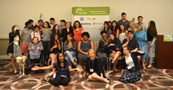 A diverse group of young people smiling and laughing in front of a banner with the Lime Connect logo and partner logos.