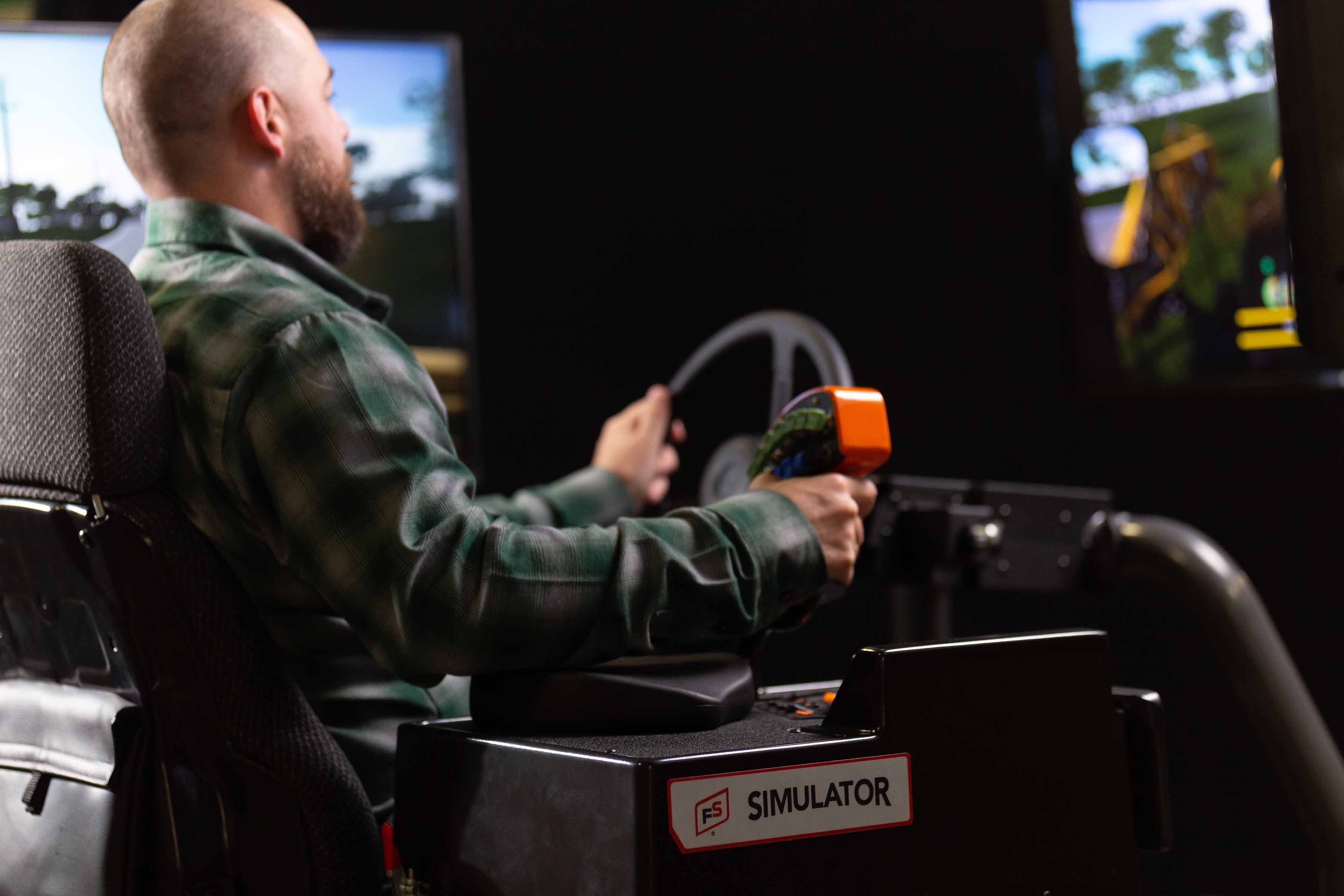 Training on GROWMARK’s FS Simulator™, students learn how to safely drive on roads and efficiently operate an ag sprayer in row crops.