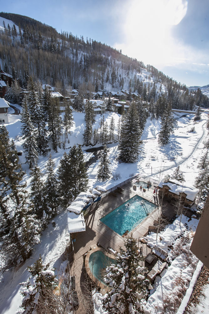 Antlers at Vail’s year-round outdoor pool and hot tubs offer guests relaxation with a stunning view of Vail Mountain.