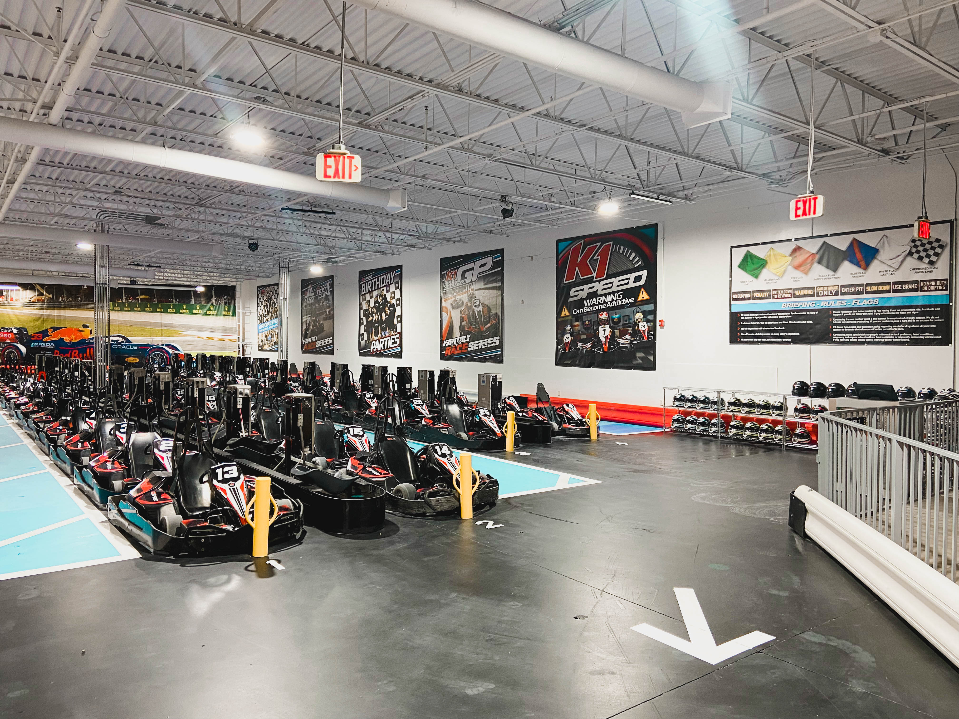 Rows of all-electric go karts for juniors and adults fill the pits inside K1 Speed Richmond