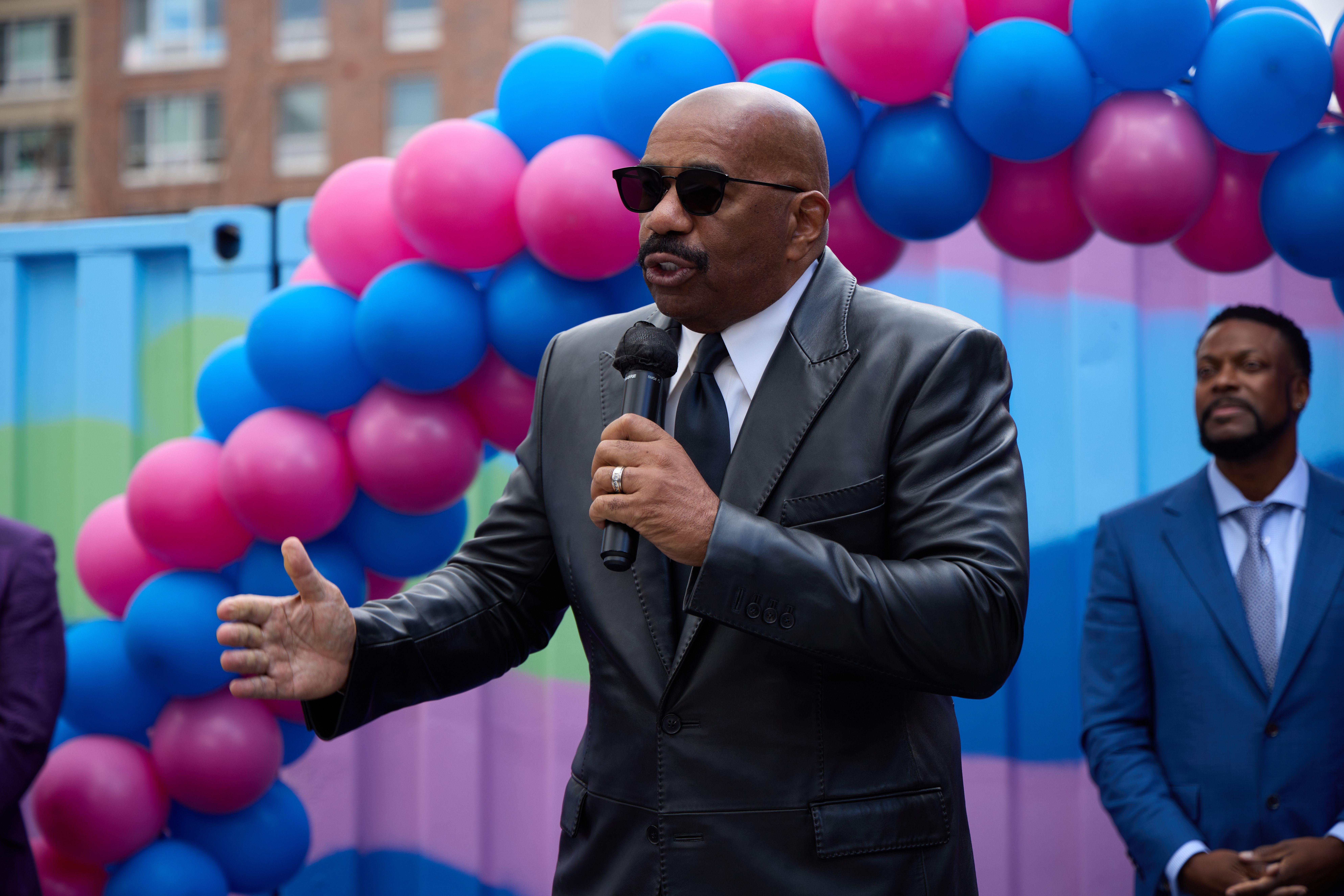 Steve Harvey giving remarks at the ribbon cutting event.