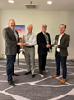 Ellis Hill (second from left) and Stan Romero (second from right) of BMMA present the Partnership Award to Mick Chambers (left) and Noah Ney (right) at the BMMA 2022 Annual Meeting in Nashville, TN.