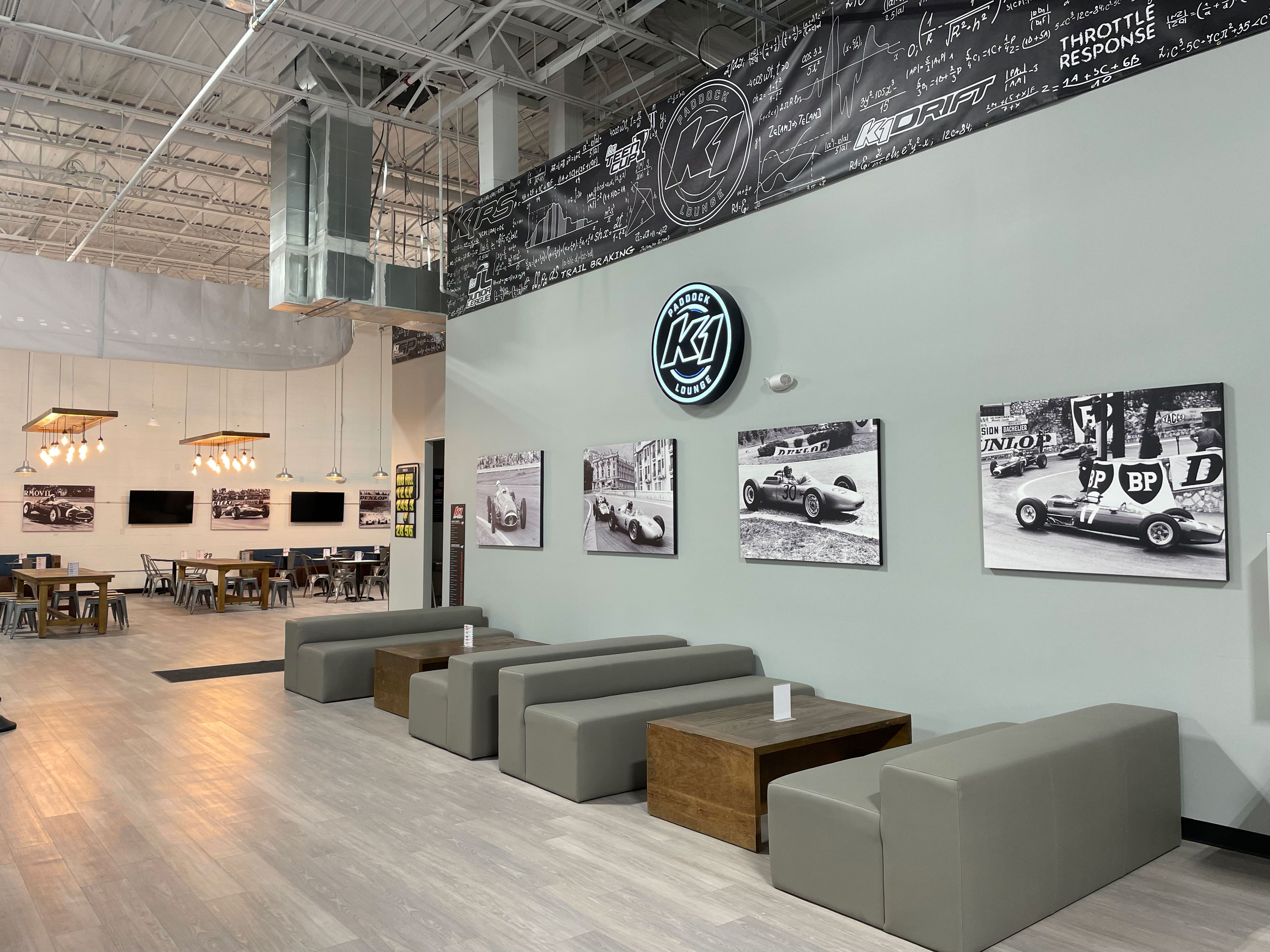 Leather couches and black and white images from racing's past decorate the center.