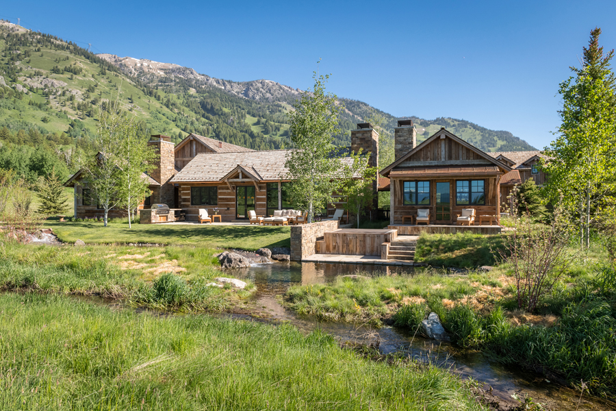 Featured in the new book “Foundations,” this JLF Architects-designed Jackson Hole mountain house connects to a shallow pond with soothing water features (PC: Audrey Hall).