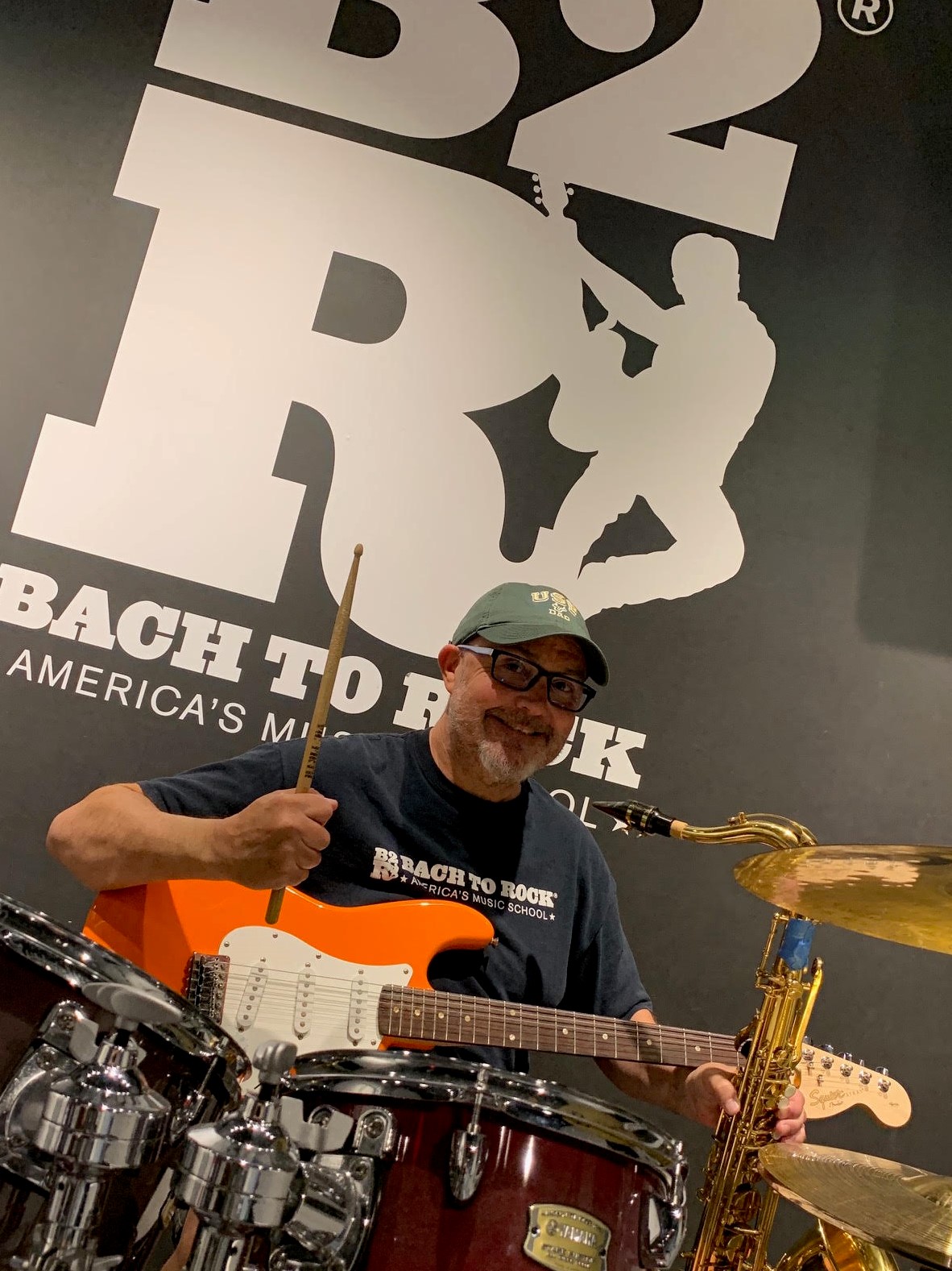 Rick Schmidt, owner of Bach to Rock Music Schools in Tampa and Orlando, has some fun on stage.