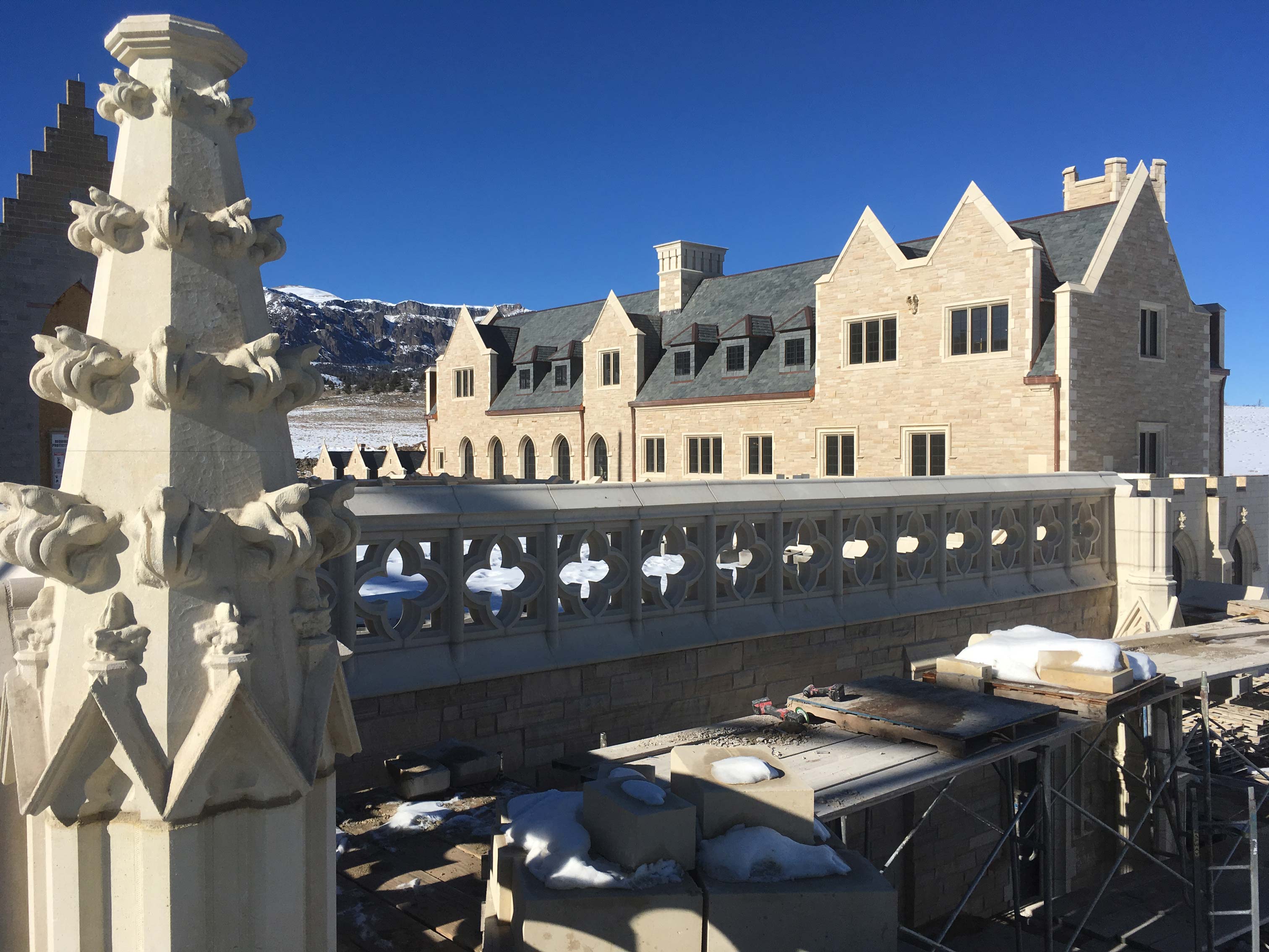 Carmelite Monks of Wyoming Monastery with Gothic architectural features in foreground