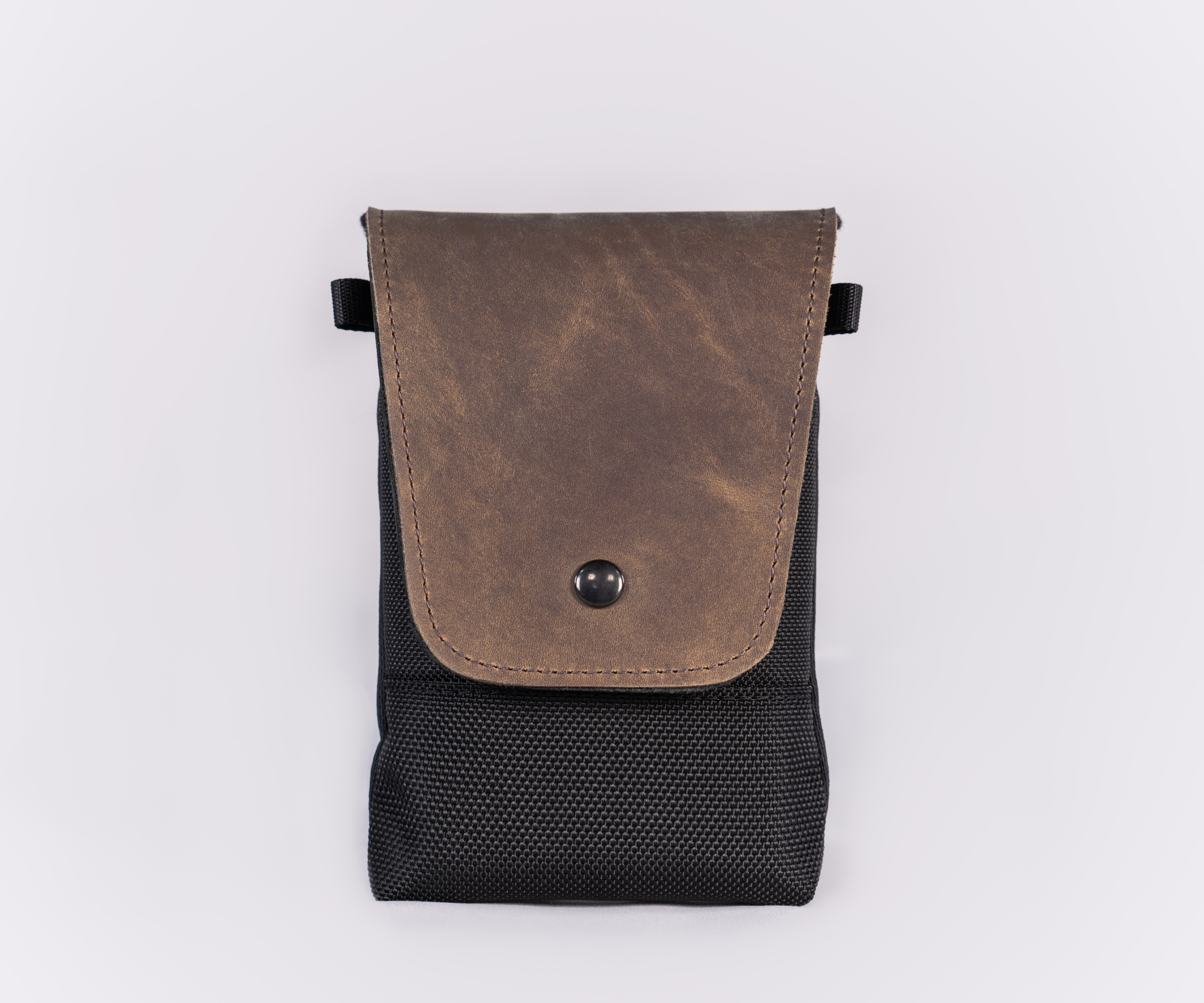 Black ballistic with full-grain chocolate leather flap