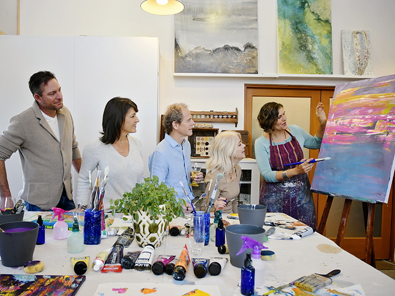 Andrea Cermanski teaching a group painting class